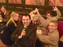 IN THE MONEY: the Hairy Marys celebrate their pub quiz victory with MC Sandro Monetti
