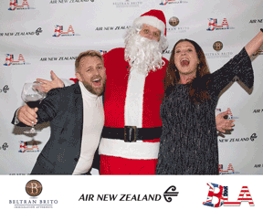 Craig and Eileen get up close and personal with 'Santa' Len Davies (Photo: Walter Tabayoyong)
